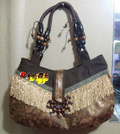 探索大理丽江民族风情 仿麂皮环形木珠流苏手提包3013